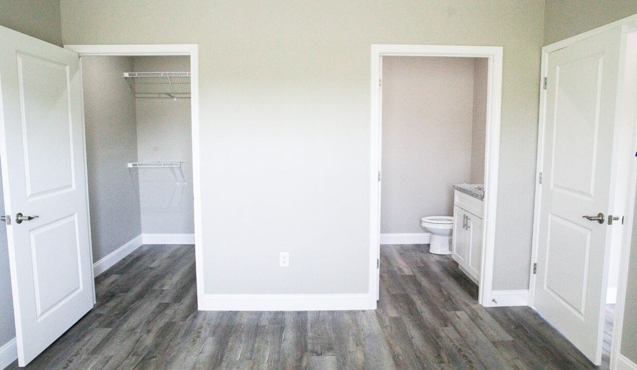 master horizontal view of closet and bath